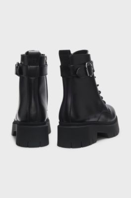 Faux-leather boots with buckled strap, Black