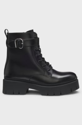 Faux-leather boots with buckled strap, Black