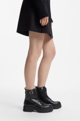 Faux-leather boots with buckled strap, Black