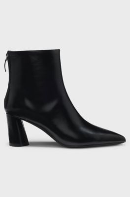 Ankle boots in leather with embossed logo, Black