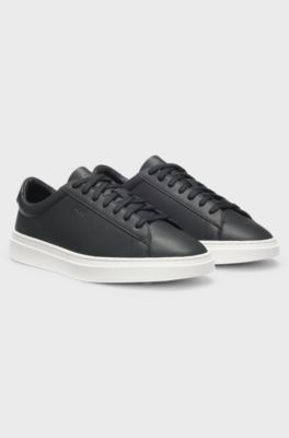 Cupsole trainers in leather with signature-stripe stitching, Black