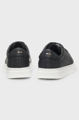 Cupsole trainers in leather with signature-stripe stitching, Black