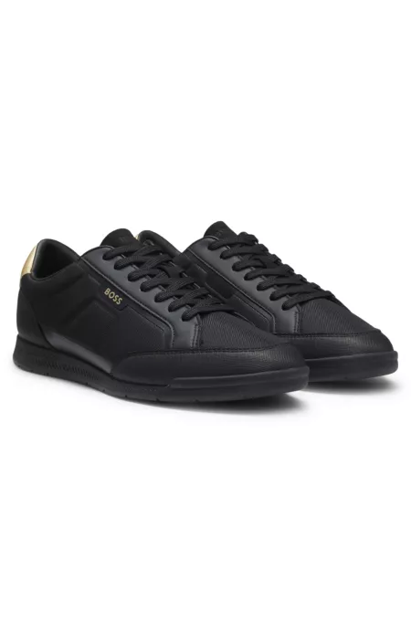 Mixed-material trainers with contrast back tab