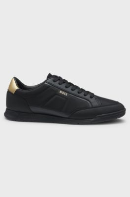 Sneakers in materiali misti con tallone a contrasto, Nero