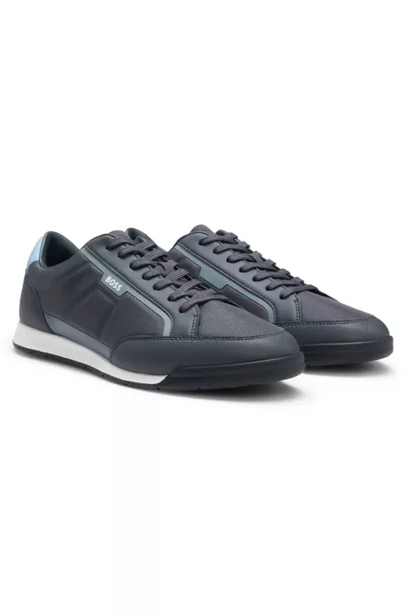 Mixed-material trainers with contrast back tab