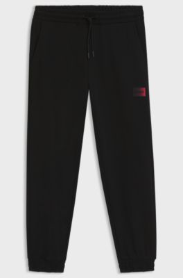 Cotton-terry tracksuit bottoms with gradient logo, Black