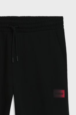 Cotton-terry tracksuit bottoms with gradient logo, Black