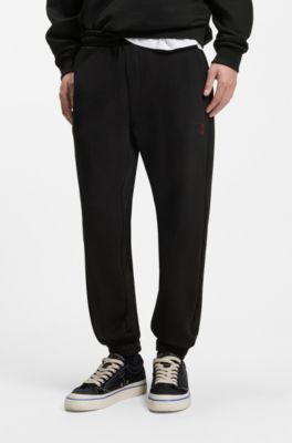 Cotton-terry tracksuit bottoms with gradient logo, Black