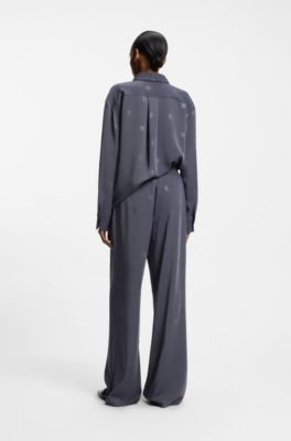 Pantaloni relaxed fit con loghi scomposti, A disegni