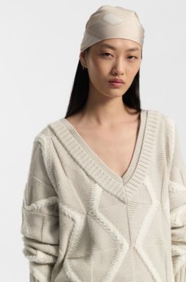 Maglione relaxed fit in lana vergine con lavorazione Aran, Beige a motivi
