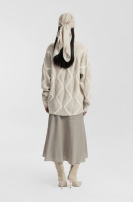 Maglione relaxed fit in lana vergine con lavorazione Aran, Beige a motivi