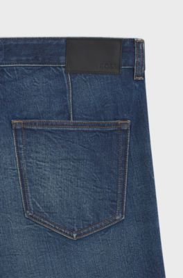 Jeans con fit affusolato in comodo denim elasticizzato effetto vissuto, Blu