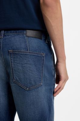 Jeans con fit affusolato in comodo denim elasticizzato effetto vissuto, Blu