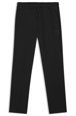 Cotton-blend tracksuit bottoms with drop-needle stripe, Black