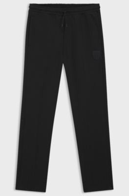 Cotton-blend tracksuit bottoms with drop-needle stripe, Black