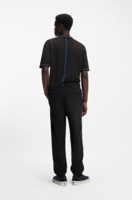 Bas de surv&ecirc;tement en molleton de coton avec logo et surpiq&ucirc;res contrastantes, Noir