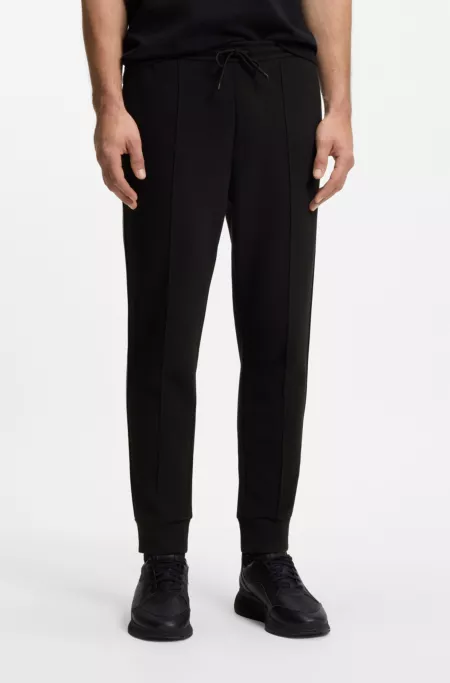 Cotton-blend tracksuit bottoms with piping details
