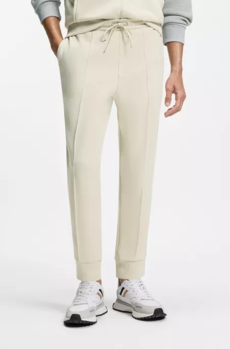 Cotton-blend tracksuit bottoms with piping details