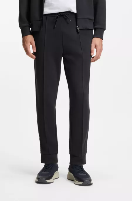 Cotton-blend tracksuit bottoms with piping details