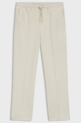 Cotton-blend tracksuit bottoms with tennis-themed logo, Natural