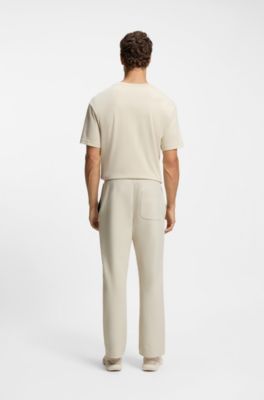 Cotton-blend tracksuit bottoms with tennis-themed logo, Natural