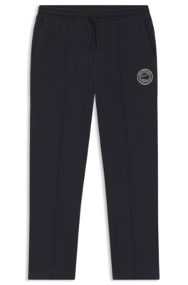 Cotton-blend tracksuit bottoms with tennis-themed logo, Dark Blue