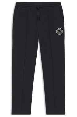 Bas de survêtement en coton mélangé avec logo d’inspiration tennis