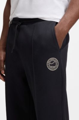 Pantaloni della tuta in misto cotone con logo ispirato al tennis, Blu scuro