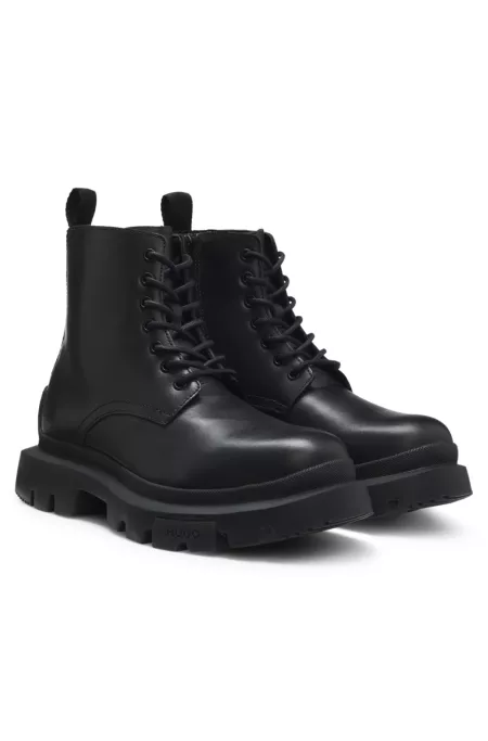 Lace-up leather boots with chunky sole