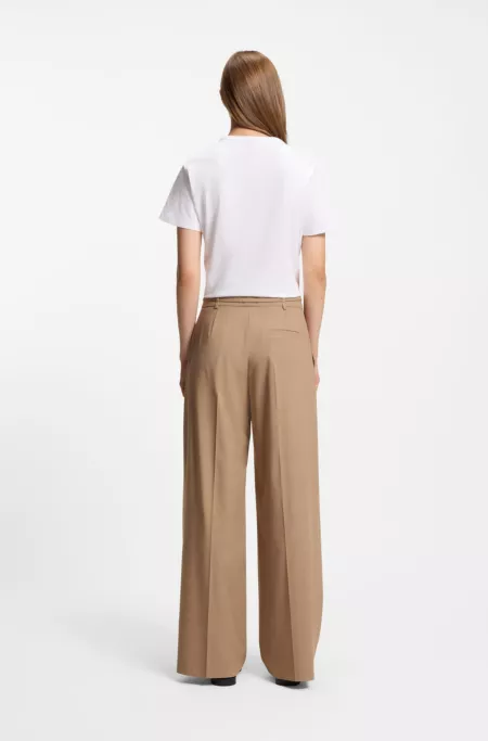 Pleat-front trousers with buckled belt