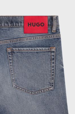 Jeans con fit affusolato in comodo denim elasticizzato blu, Celeste