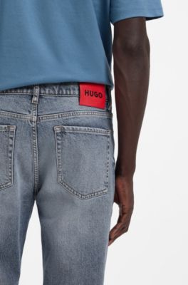 Jeans con fit affusolato in comodo denim elasticizzato blu, Celeste