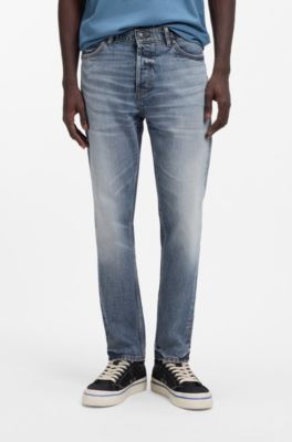 Jeans con fit affusolato in comodo denim elasticizzato blu, Celeste