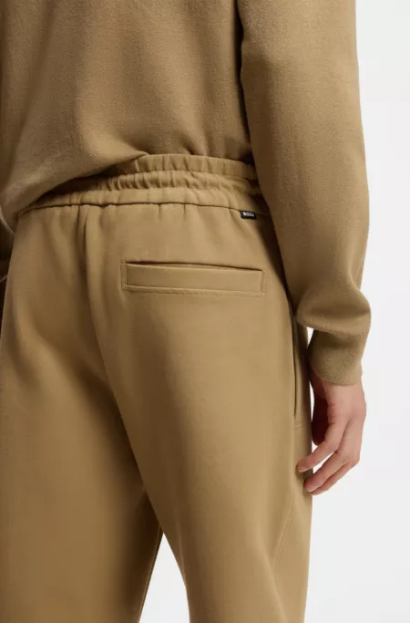 Cotton-blend tracksuit bottoms with pintuck pleat
