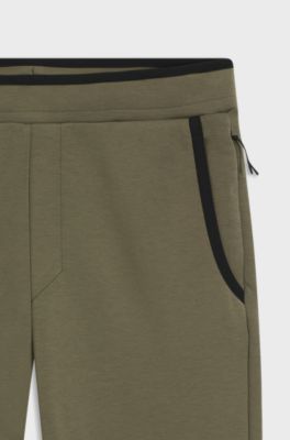 Regular-fit tracksuit bottoms in super-soft stretch fabric, Olive
