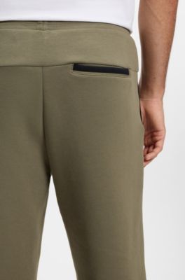 Regular-fit tracksuit bottoms in super-soft stretch fabric, Olive