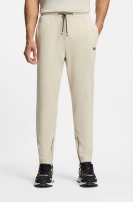 Active Stretch-gabardine tracksuit bottoms with zipped hems, Natural