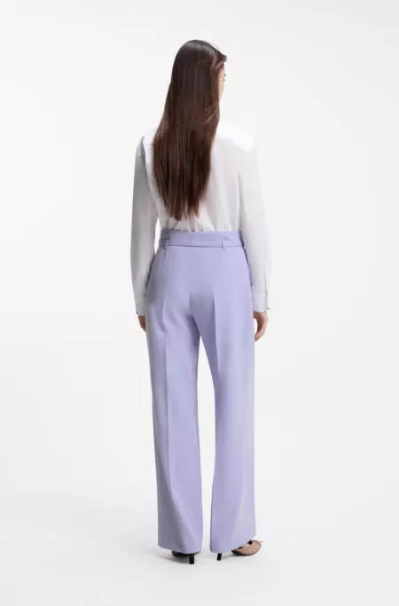 Pleat-front trousers with buckled belt