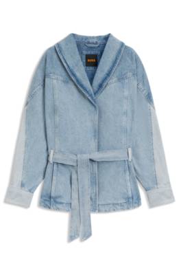 Peplum-hem jacket in blue rigid denim with belt