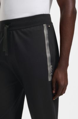 Cotton-terry tracksuit bottoms with logo and stripe, Black
