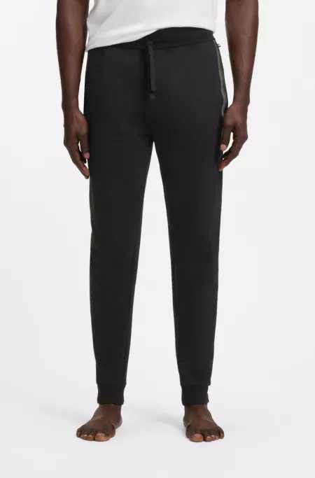 Cotton-terry tracksuit bottoms with stripes and logo