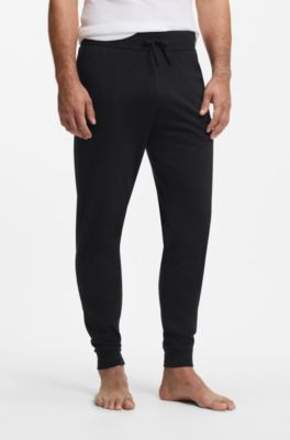 Bas de surv&ecirc;tement en molleton de coton avec logo et rayure, Noir