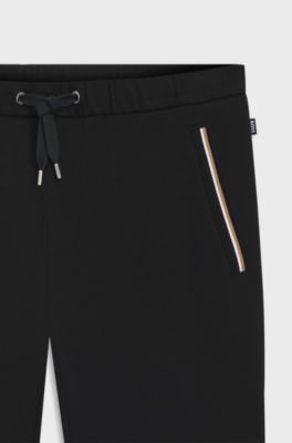 Cotton-terry tracksuit bottoms with signature stripes, Black