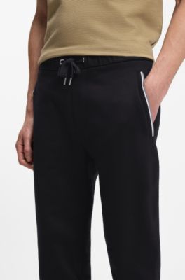 Cotton-terry tracksuit bottoms with signature stripes, Black
