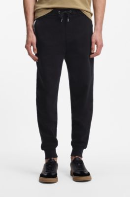 Cotton-terry tracksuit bottoms with signature stripes, Black