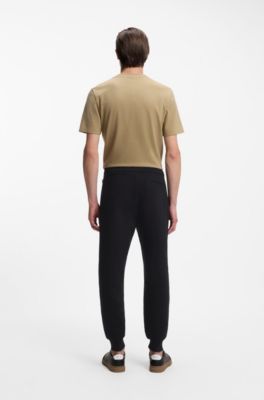 Cotton-terry tracksuit bottoms with signature stripes, Black