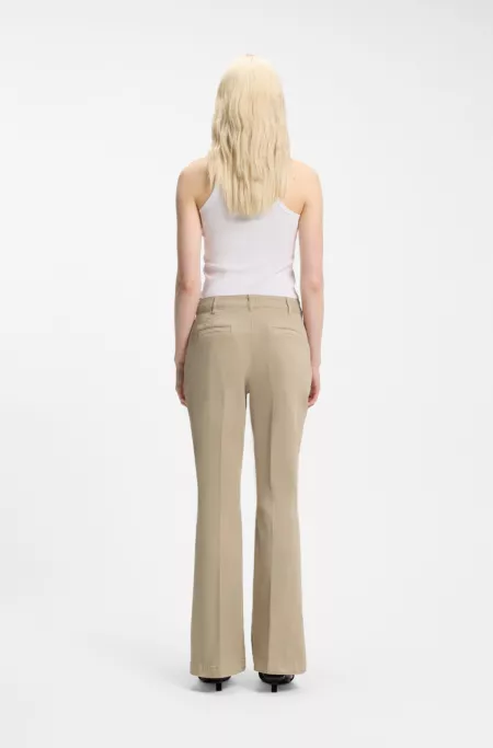 Slim-fit trousers with flared leg