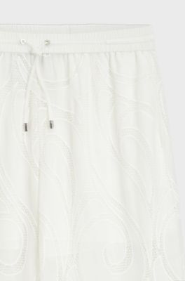 Pantalon coupe d&eacute;contract&eacute;e avec fleurs brod&eacute;es, Blanc