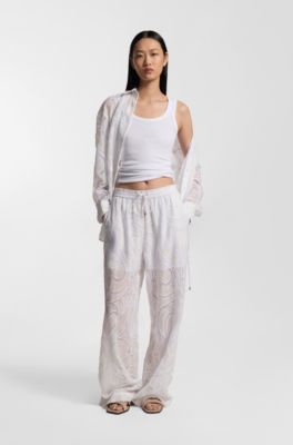 Relaxed-fit trousers with embroidered flowers, Natural