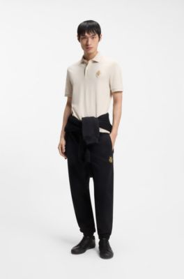 Cotton-piqu&eacute; polo shirt with logo artwork, Natural